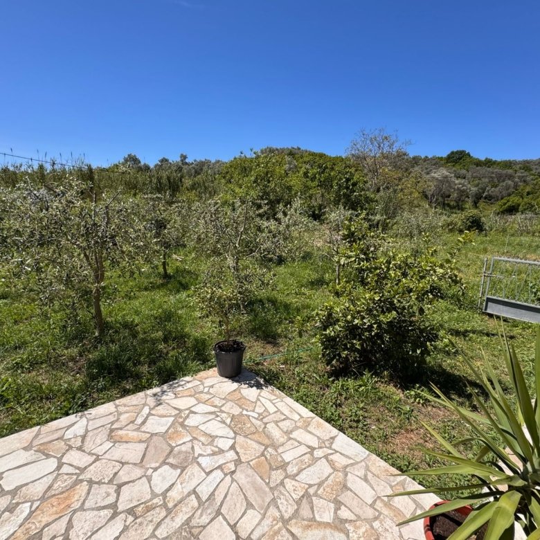 Charming stone patio with lush yard views in Ulcinj&mdash;prime Montenegro investment. Exclusive on immorenta.me by ekosphere doo.
