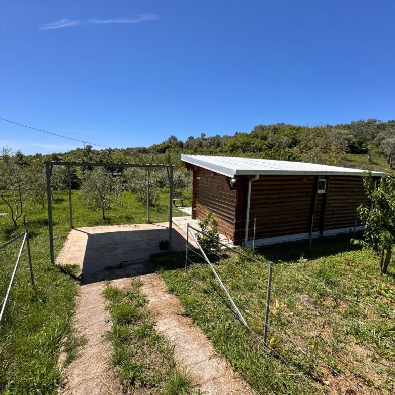 Charming wooden cabin with metal roof, lush grounds & modern path in Ulcinj&mdash;prime investment at immorenta.me by Ekosphere DOO.