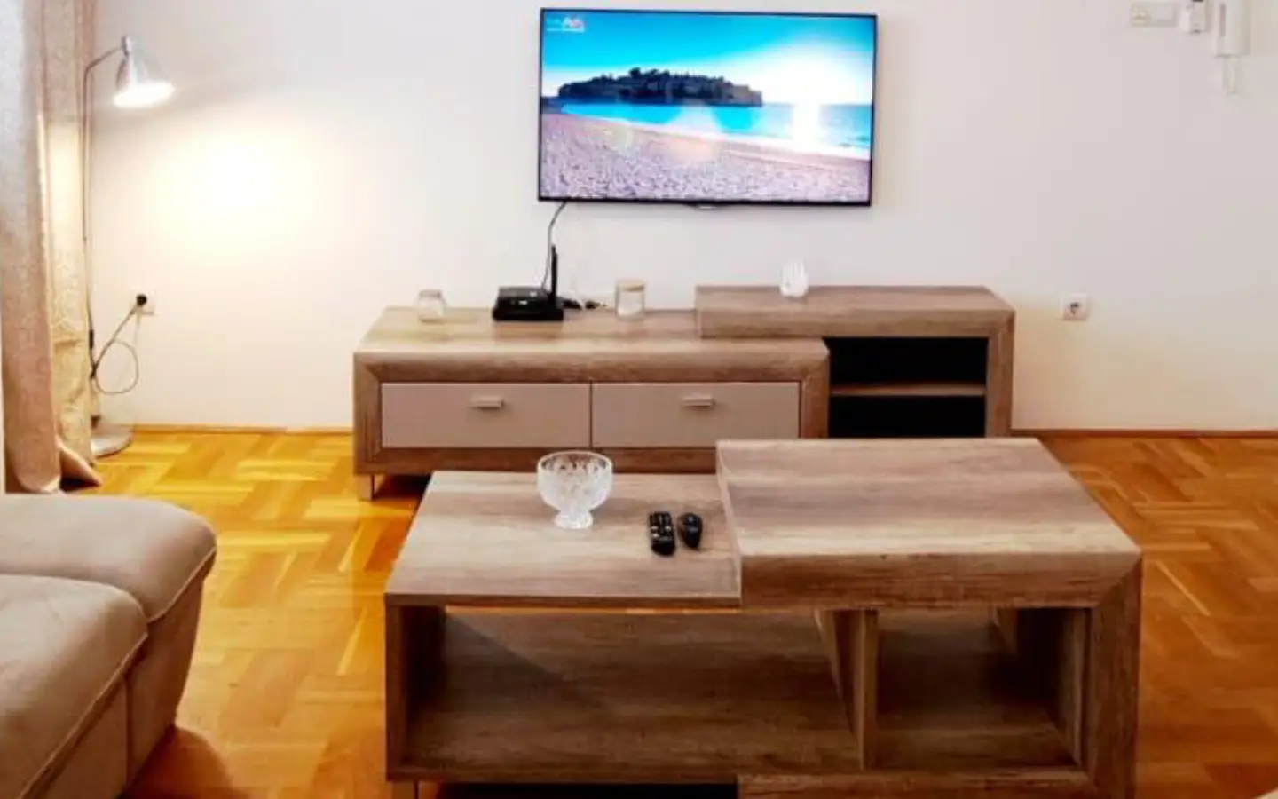 Stunning Ulcinj Montenegro property: modern living room, sleek TV, stylish wood accents, ideal investment by ekosphere doo on immorenta.me.
