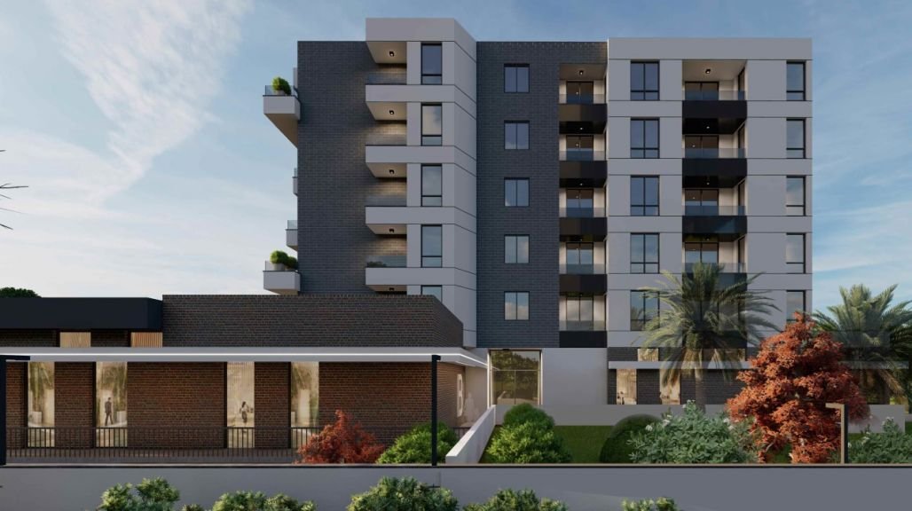 Contemporary Ulcinj apartment building with balconies, large windows, and lush greenery&mdash;exclusive property from immorenta.me, a project by ekosphere doo.