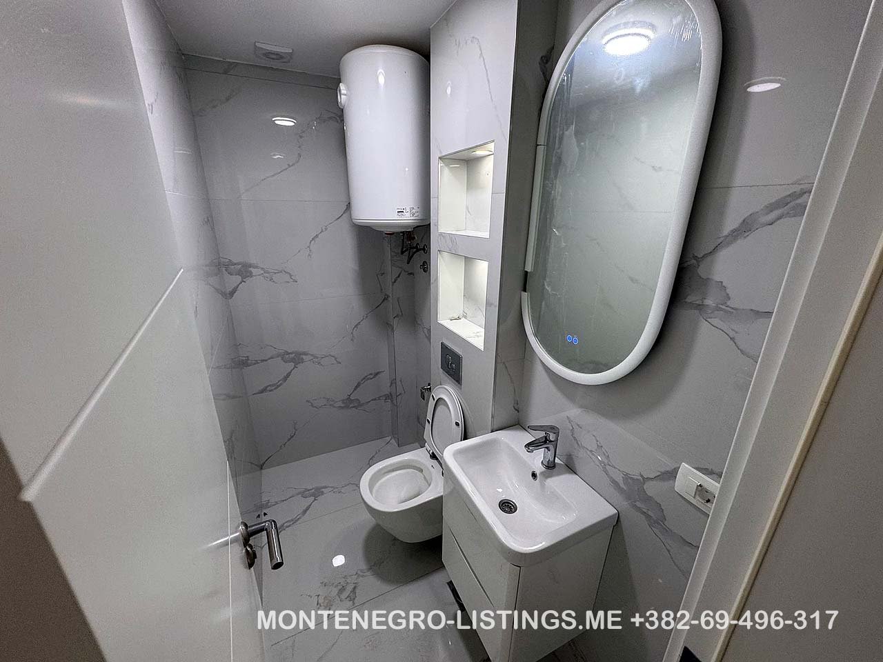 Modern bathroom with sink and toilet, ideal for Ulcinj property investment. On immorenta.me by ekosphere doo.