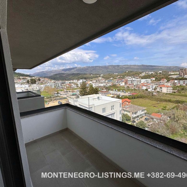 Modern covered balcony with tiled floor, stunning Ulcinj real estate views, ideal for investment. Visit immorenta.me by ekosphere doo.