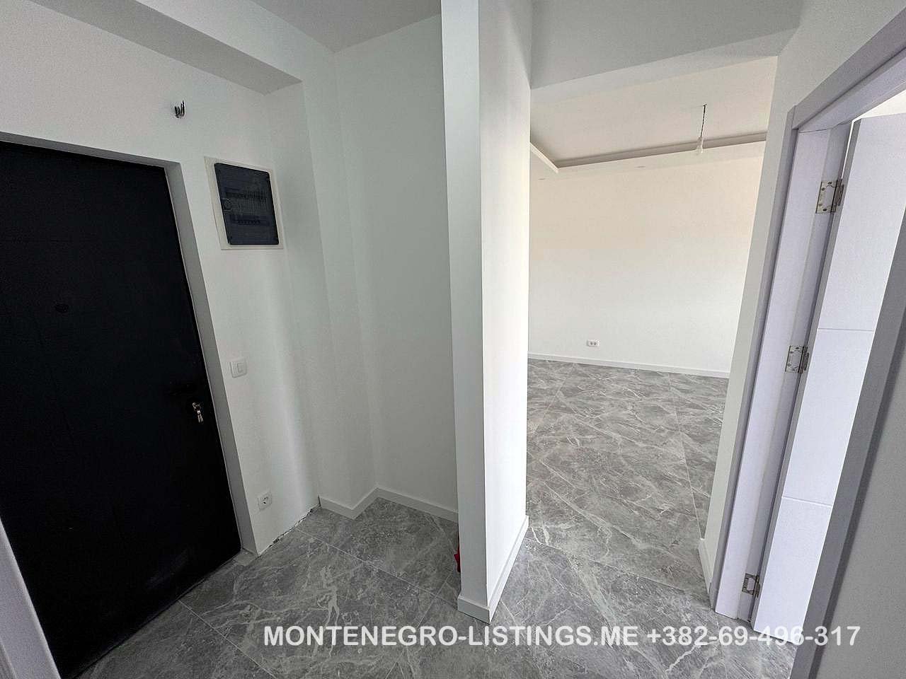 Contemporary interior in Ulcinj: gray tiled floors, white walls, bright open space. Invest with immorenta.me by ekosphere doo.