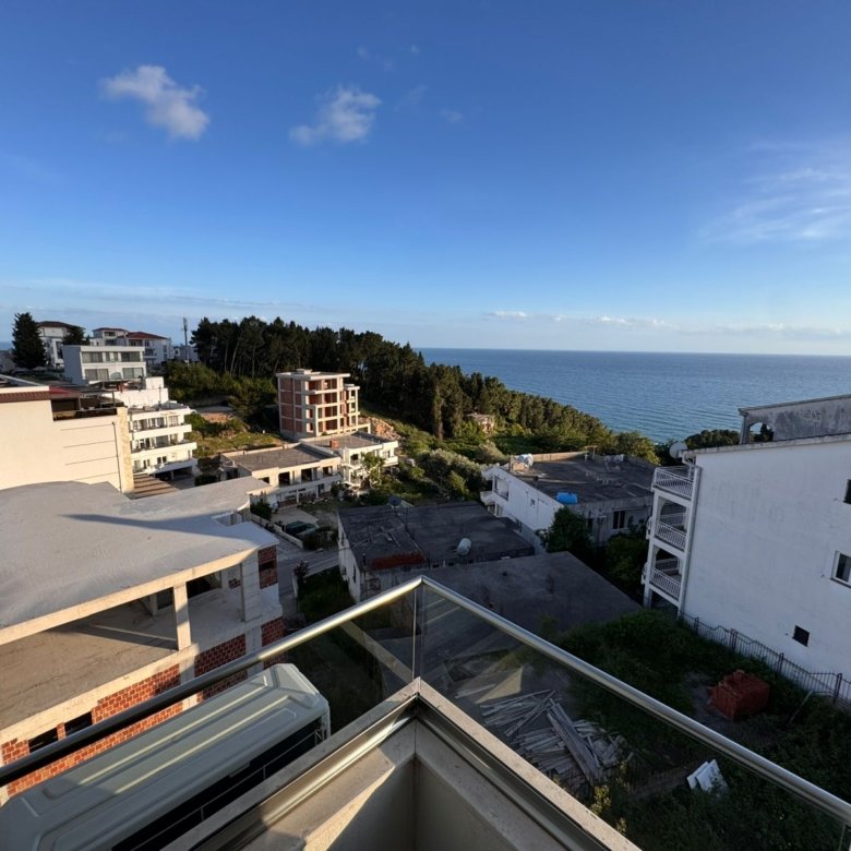 Premium balcony views of Ulcinj real estate&mdash;white homes, lush hills, distant blue sea. Invest with immorenta.me by ekosphere doo.
