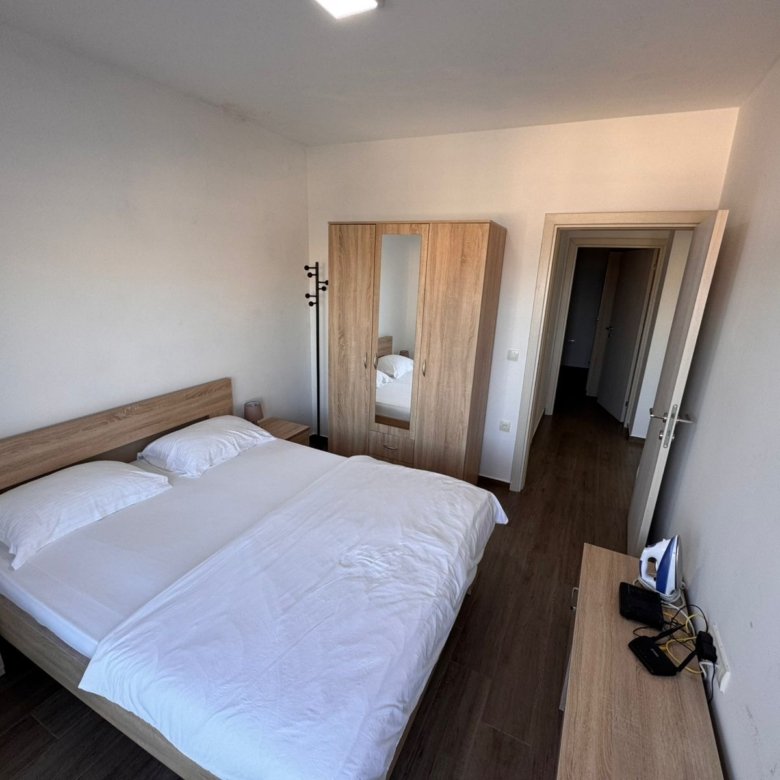 Modern Ulcinj property for sale: bright bedroom with double bed, wardrobe, and more. Listed on immorenta.me by ekosphere doo.