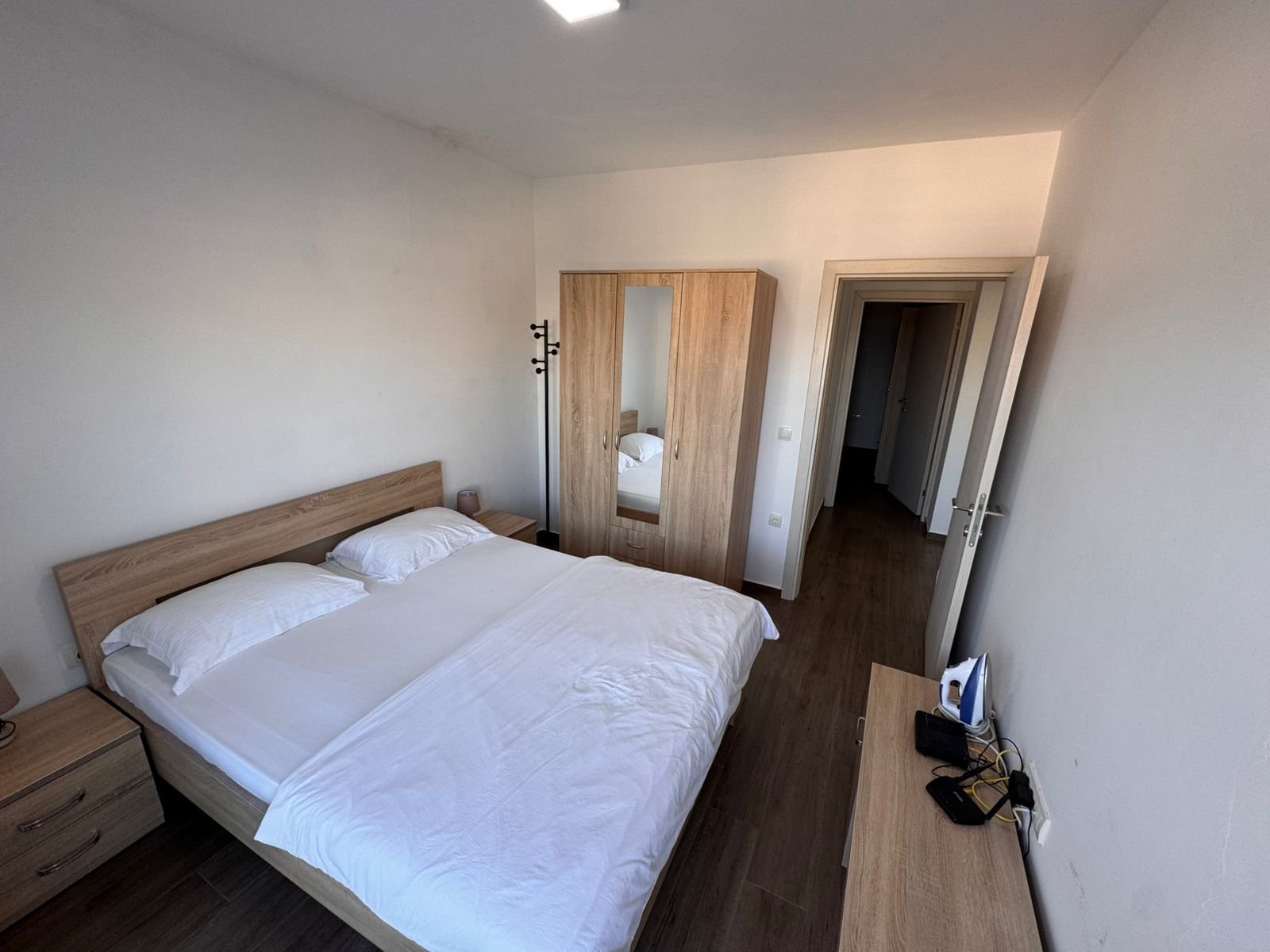Modern Ulcinj property for sale: bright bedroom with double bed, wardrobe, and more. Listed on immorenta.me by ekosphere doo.