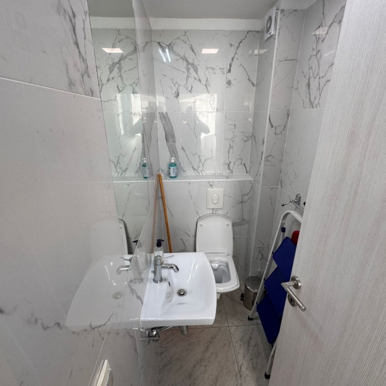 Stylish Ulcinj bathroom with marble walls, modern fixtures&mdash;ideal Montenegro investment. Exclusive on immorenta.me by ekosphere doo.