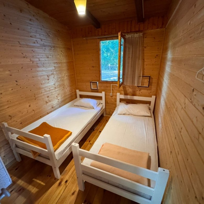 Cozy wooden room in Ulcinj with twin beds, natural light, and amenities&mdash;ideal Montenegro investment via immorenta.me by ekosphere doo.