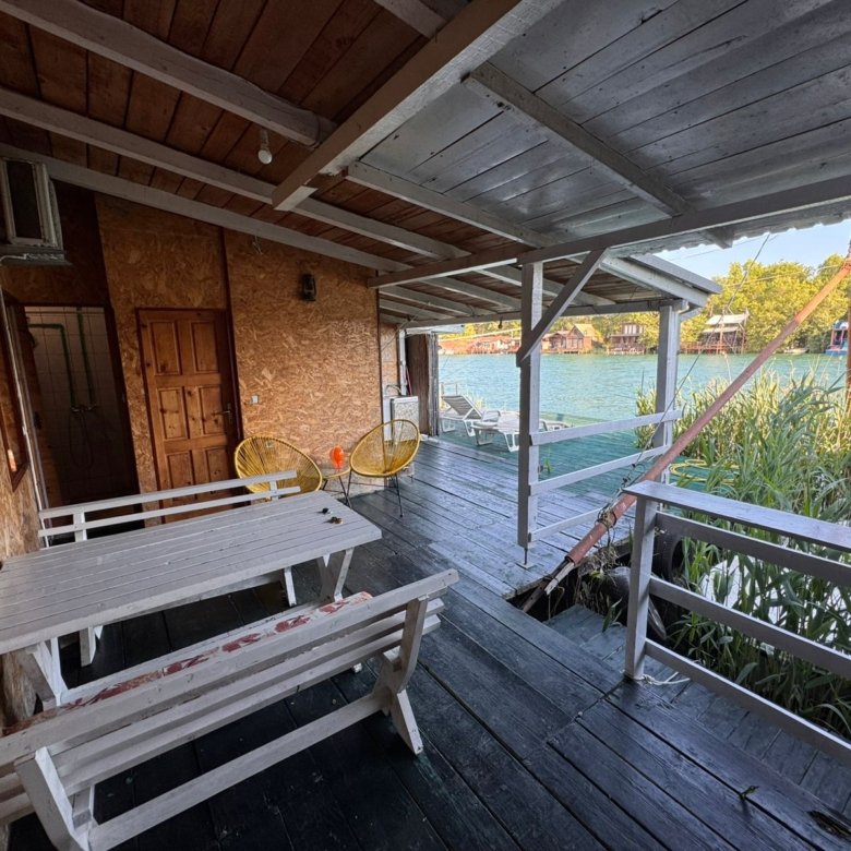 Experience Ulcinj luxury&mdash;covered deck, water views, modern seating. Prime investment at immorenta.me by Ekosphere DOO.