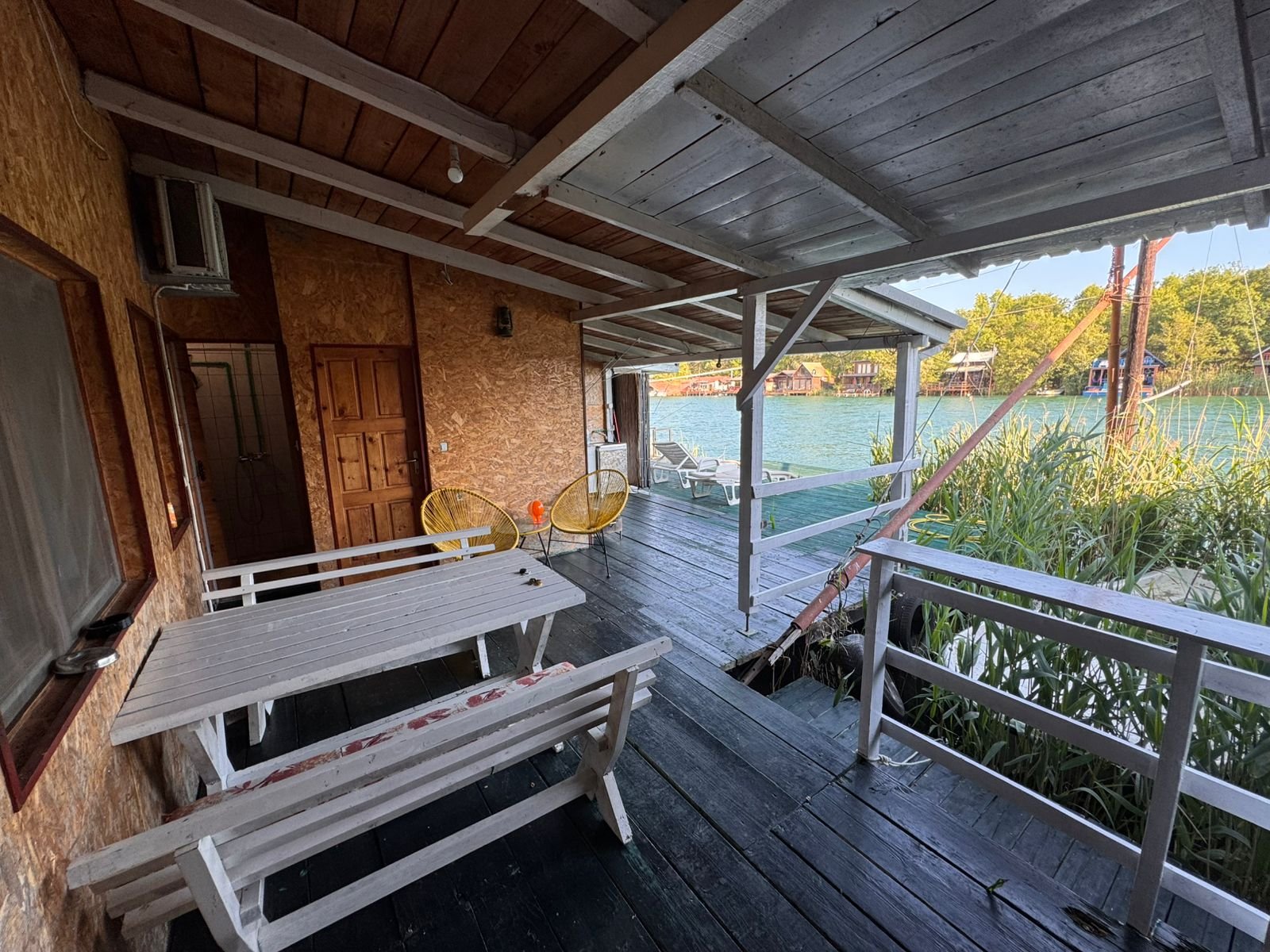 Experience Ulcinj luxury&mdash;covered deck, water views, modern seating. Prime investment at immorenta.me by Ekosphere DOO.