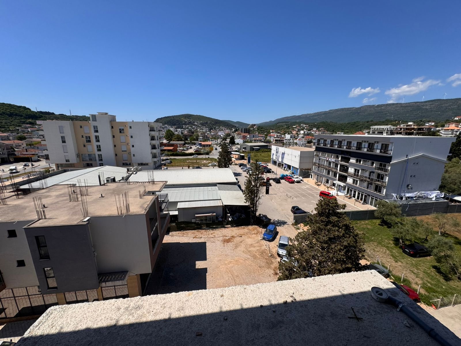 Rooftop view in Ulcinj, Montenegro: prime real estate, development sites, lush greenery, hills&mdash;exclusive at immorenta.me by ekosphere doo.