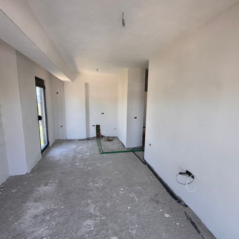 Investment opportunity in Ulcinj! Unfinished interior with open floorplan, utilities exposed&mdash;customize your Montenegro dream home.