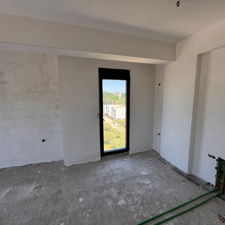 Unfinished Ulcinj property with concrete floors, white walls, and city views&mdash;exclusive on immorenta.me by Ekosphere doo.