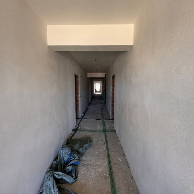Prime Ulcinj property opportunity&mdash;spacious unfinished hallway, natural light, investment-ready on immorenta.me by ekosphere doo.