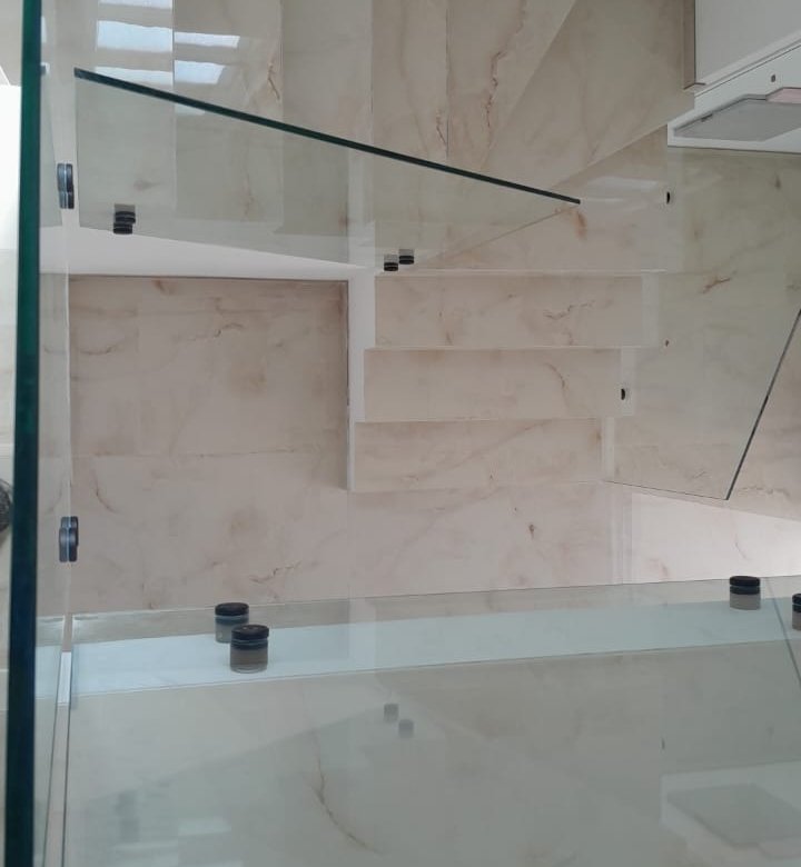 Stunning marble staircase with glass railings, bright natural light&mdash;luxury Ulcinj real estate. Exclusive on immorenta.me by ekosphere doo.