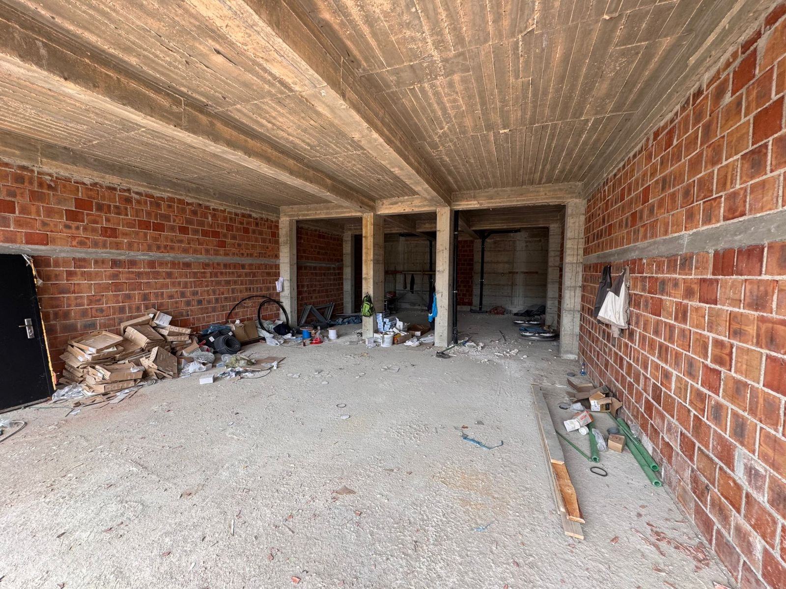 Prime investment opportunity in Ulcinj: unfinished space with exposed brick, concrete floors, open layout&mdash;immorenta.me by ekosphere doo.