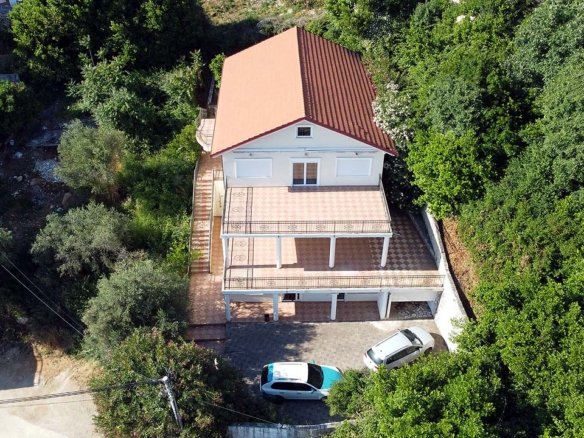 Exclusive two-story house with red roof, spacious terrace & parking in lush Ulcinj hills&mdash;prime investment by Ekosphere on immorenta.me.