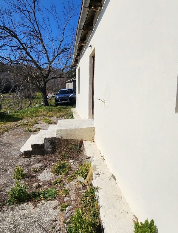 Modern beige building with concrete steps, set amid open greenery under Ulcinj&rsquo;s blue sky&mdash;exclusive on immorenta.me by ekosphere doo.