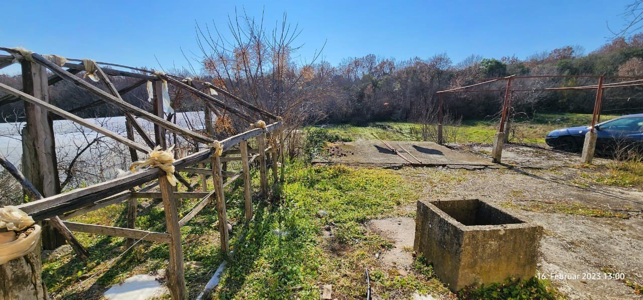 Prime Ulcinj property: spacious sunny plot, lush trees, car access, well & wooden structure&mdash;ideal Montenegro investment by ekosphere doo.