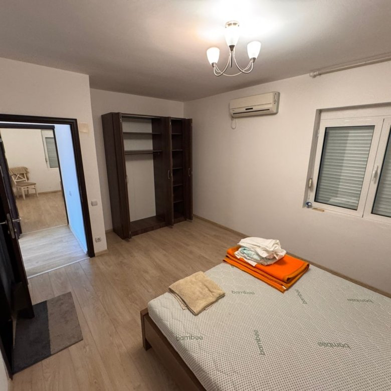 Modern Ulcinj bedroom with wood floors, open wardrobe, AC, double windows&mdash;exclusive on immorenta.me by Ekosphere doo.