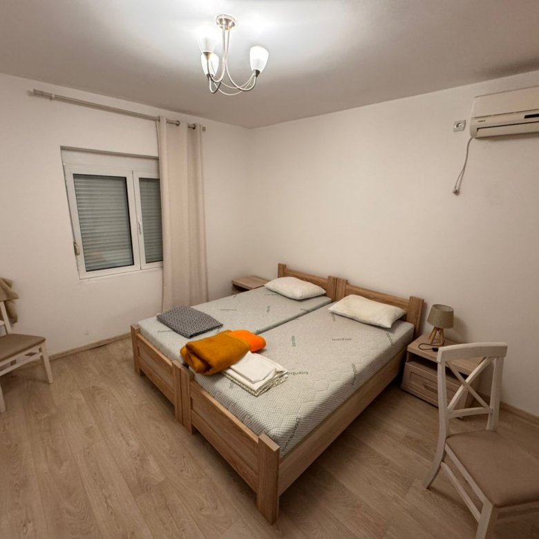 Bright Ulcinj bedroom with twin beds, A/C, window, modern lighting&mdash;ideal Montenegro investment via immorenta.me by Ekosphere doo.