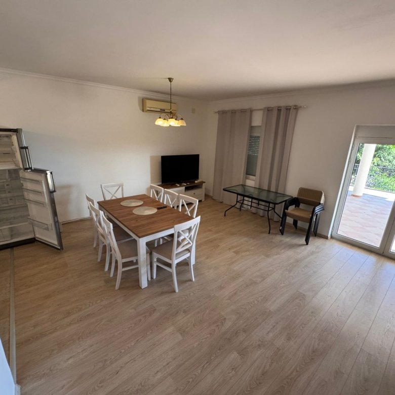 Modern, spacious Ulcinj apartment with light wood floors, dining area, open kitchen, and large windows&mdash;exclusive at immorenta.me by ekosphere doo.