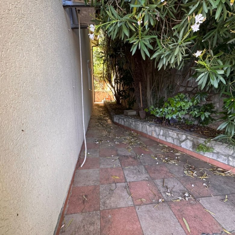 Charming tiled pathway in Ulcinj, Montenegro&mdash;ideal for serene living or investment. Listed on immorenta.me by ekosphere doo.