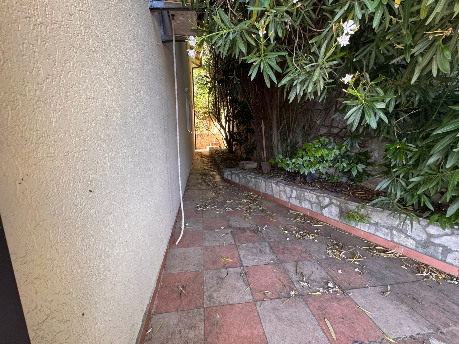 Charming tiled pathway in Ulcinj, Montenegro&mdash;ideal for serene living or investment. Listed on immorenta.me by ekosphere doo.