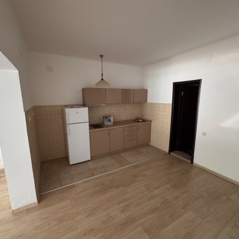 Charming kitchen in Ulcinj with stylish cabinets, tiled accents, and modern appliances. Invest smart at immorenta.me by Ekosphere.