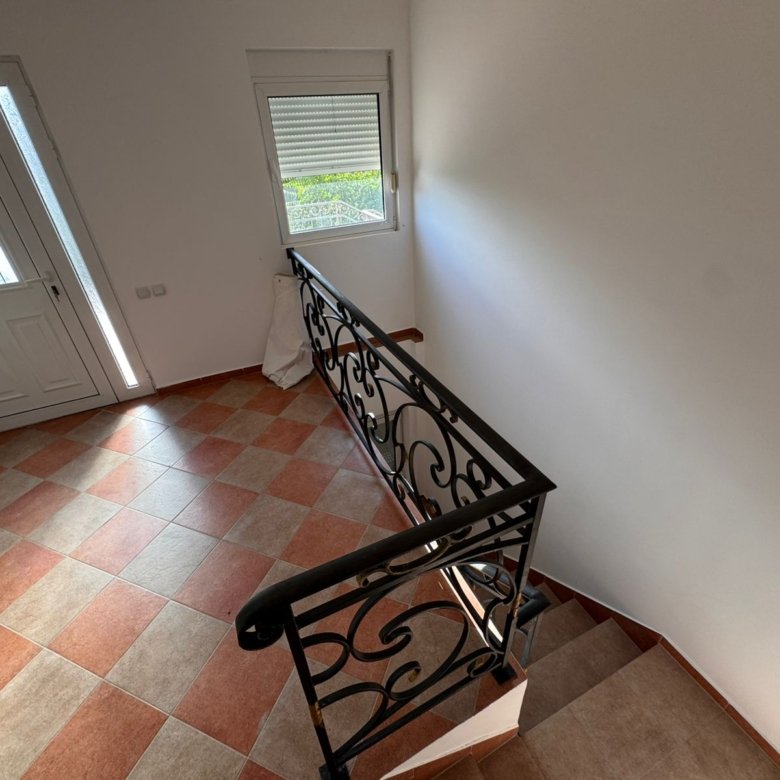 Stylish tiled hallway in Ulcinj Montenegro real estate, elegant staircase, modern entry&mdash;exclusive listing by immorenta.me, a project of ekosphere doo.