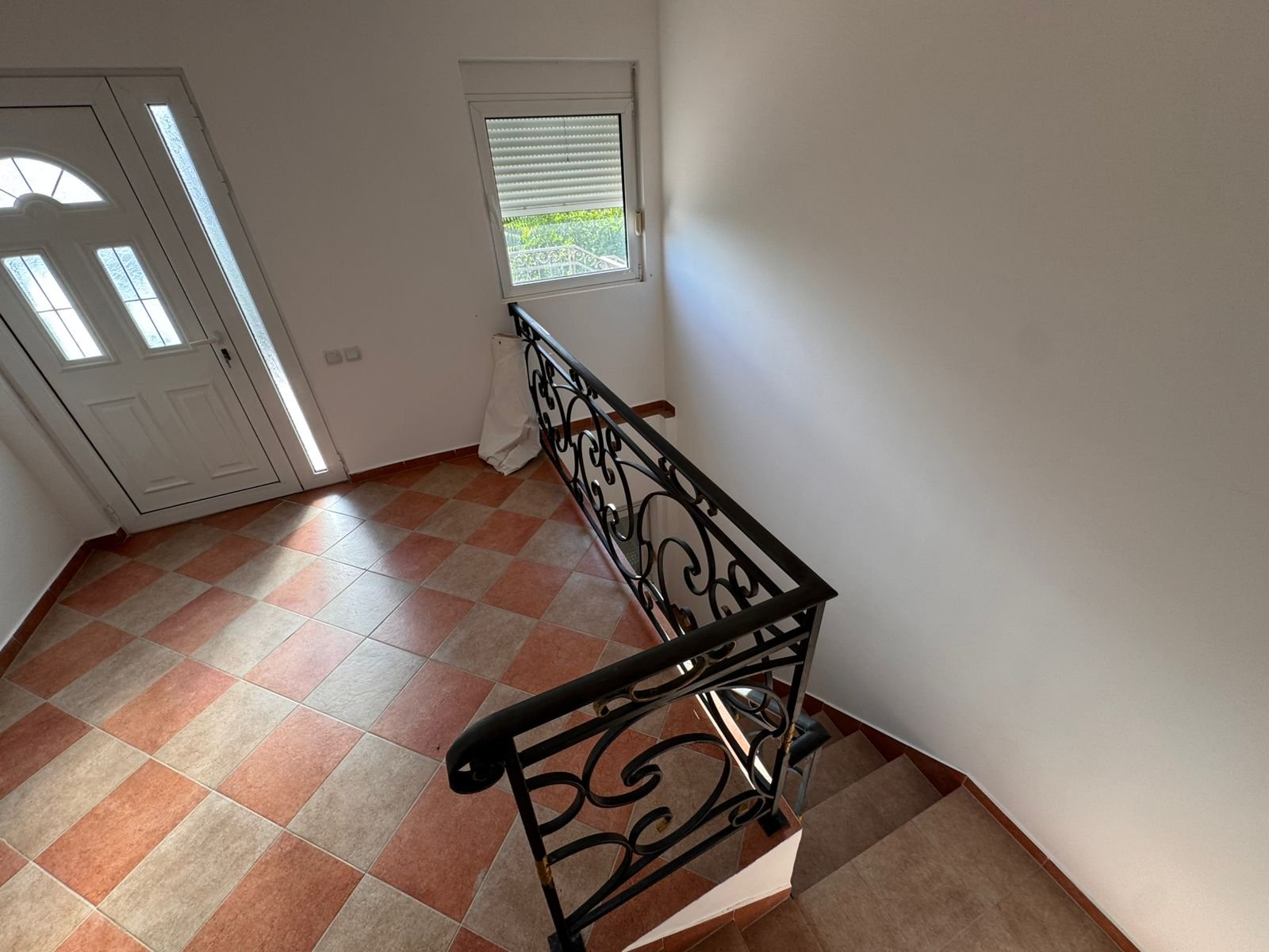 Stylish tiled hallway in Ulcinj Montenegro real estate, elegant staircase, modern entry&mdash;exclusive listing by immorenta.me, a project of ekosphere doo.