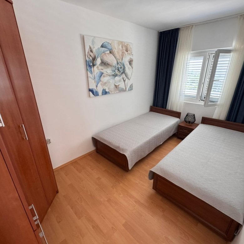 Charming Ulcinj bedroom with twin beds, stylish decor and ample storage&mdash;ideal Montenegro investment from ekosphere doo at immorenta.me.