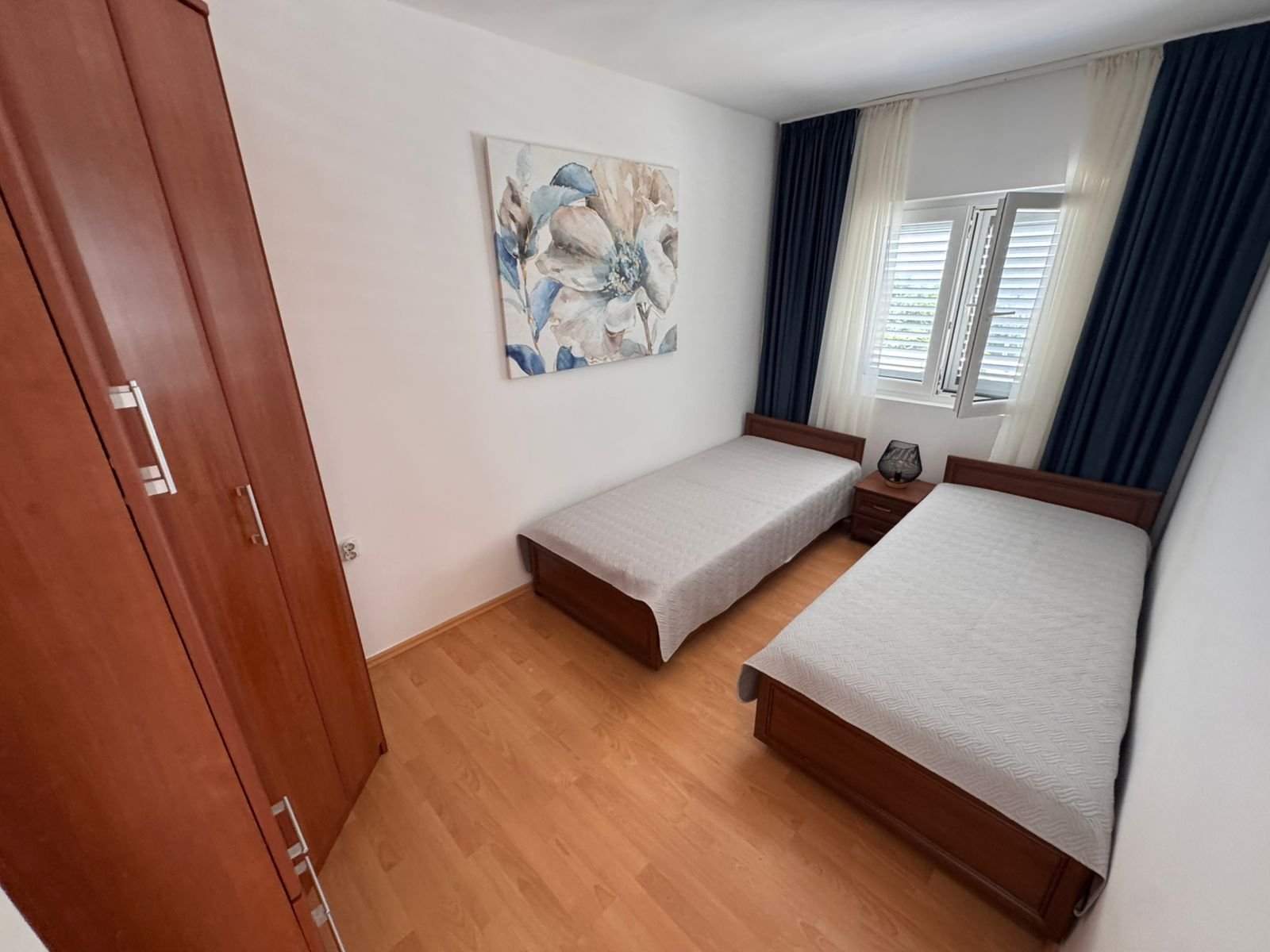 Charming Ulcinj bedroom with twin beds, stylish decor and ample storage&mdash;ideal Montenegro investment from ekosphere doo at immorenta.me.
