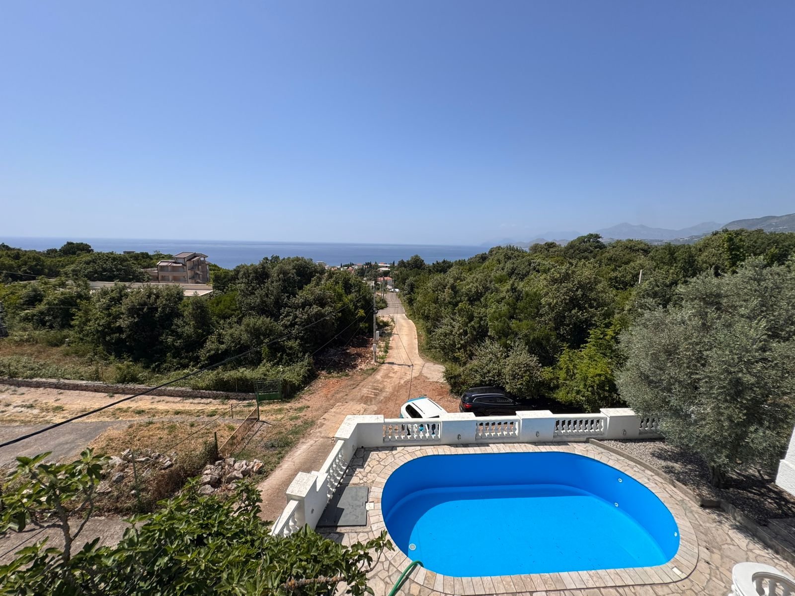 Stunning Ulcinj villa with blue pool, sea views, and lush greenery&mdash;prime Montenegro real estate from ekosphere doo on immorenta.me.