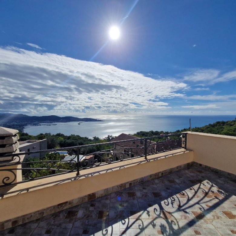 Stunning tiled terrace in Ulcinj with panoramic bay, hillside, and rooftop views&mdash;prime Montenegro real estate by Ekosphere on immorenta.me.