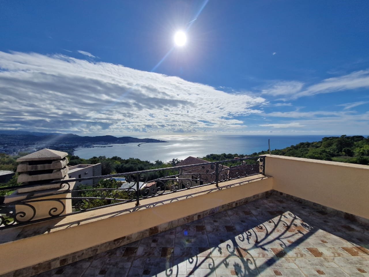 Stunning tiled terrace in Ulcinj with panoramic bay, hillside, and rooftop views&mdash;prime Montenegro real estate by Ekosphere on immorenta.me.