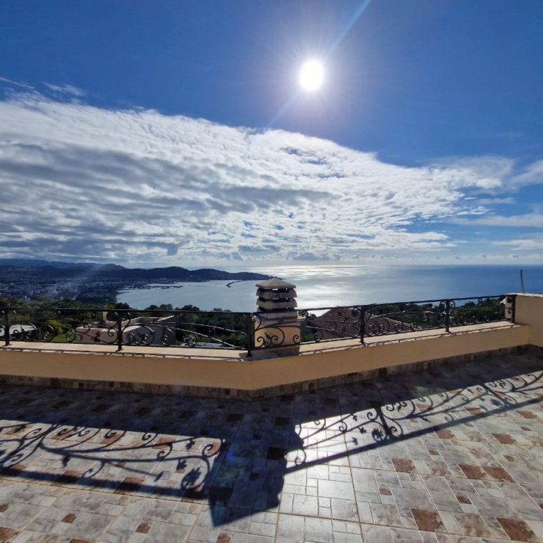 Invest in Ulcinj - Elegant sunlit terrace with patterned tiles, ornate railings, and stunning sea views in Ulcinj&mdash;exclusive on immorenta.me by Ekosphere doo.