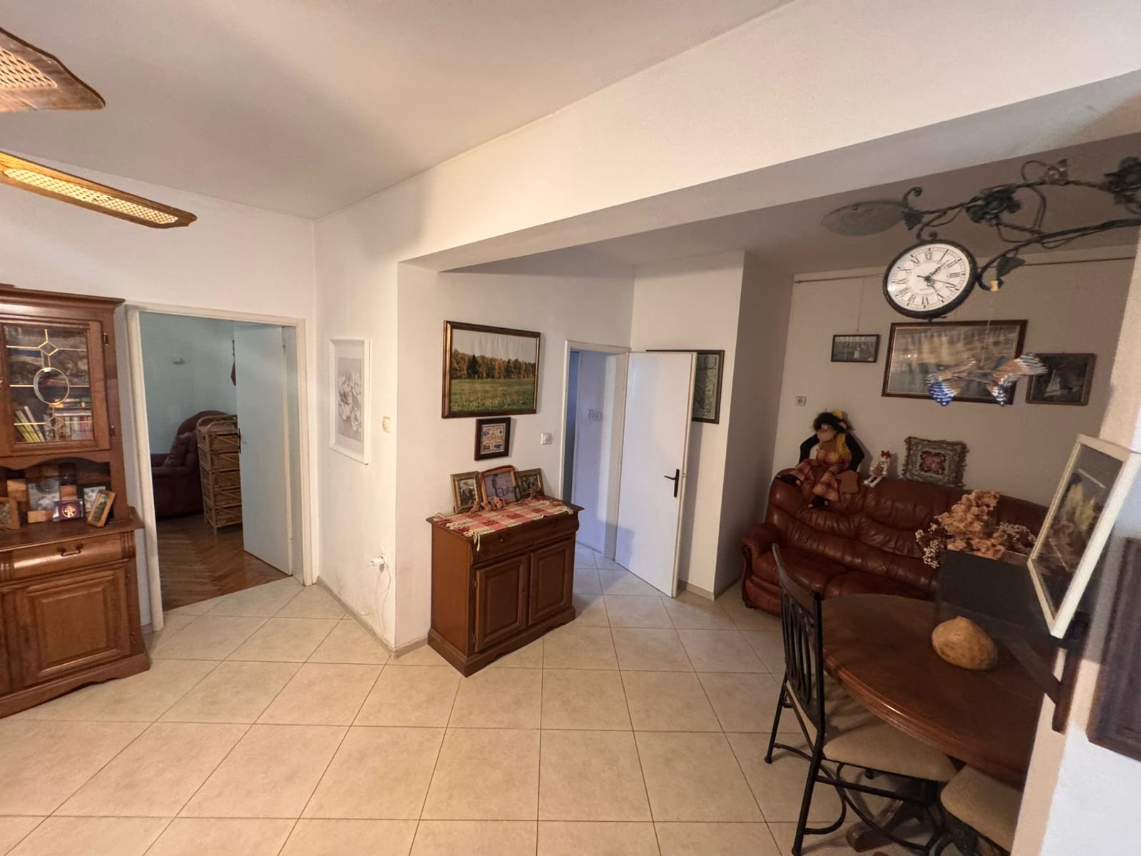 Stylish Ulcinj living room with tiled floors, wooden accents, dining area, and sofa&mdash;premium property by Ekosphere on immorenta.me.