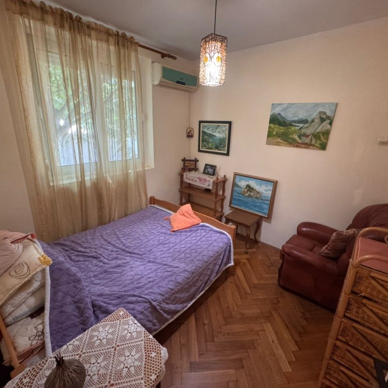 Charming Ulcinj bedroom with a single bed, quality wood furniture, airy curtains&mdash;ideal Montenegro investment at immorenta.me by ekosphere doo.