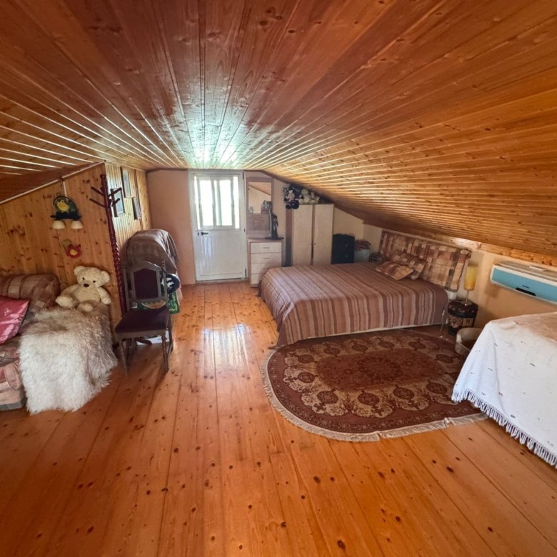 Charming attic room in Ulcinj, Montenegro with sloped wood ceiling, AC, and cozy decor&mdash;listed on immorenta.me by Ekosphere DOO.
