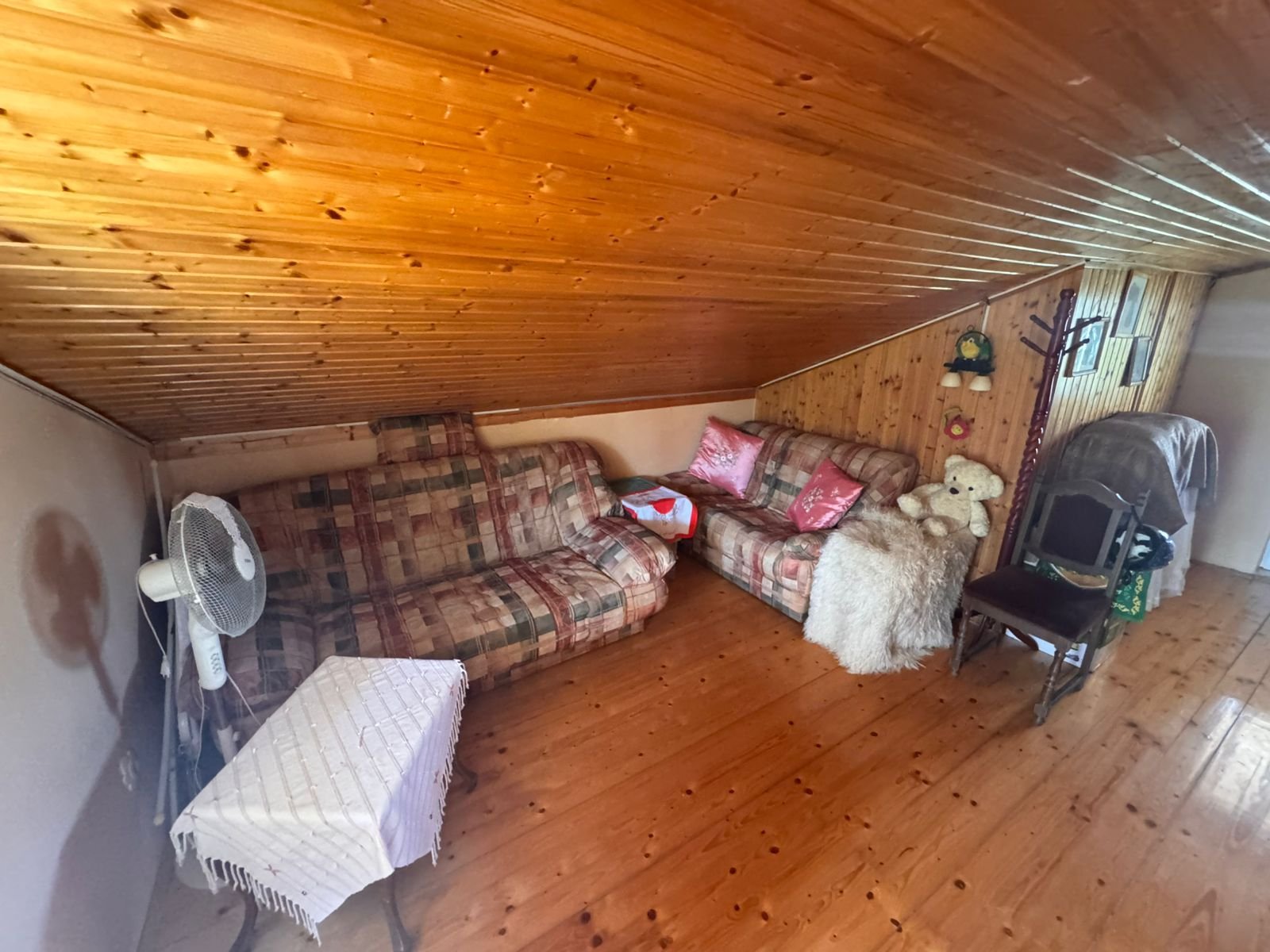 Charming attic room in Ulcinj, Montenegro with wood finishes, stylish sofas, ideal investment. Listed by immorenta.me (Ekosphere doo).