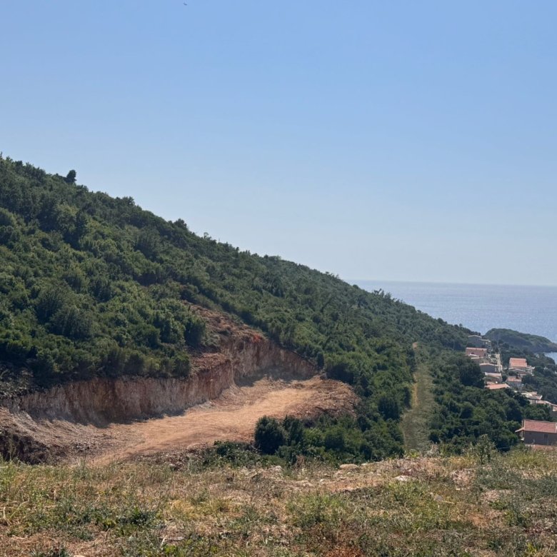Prime cleared land on a green coastal hill in Ulcinj, Montenegro&mdash;ideal for investment; sea-view homes nearby. See immorenta.me by ekosphere doo.