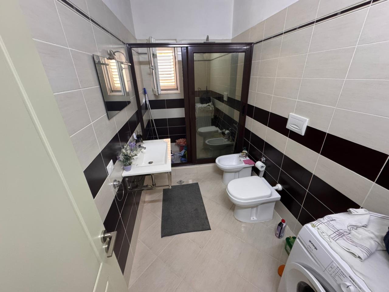 Stylish modern bathroom in Ulcinj with premium tiles, glass shower, bidet, washer&mdash;exclusive listing by immorenta.me/Ekosphere.