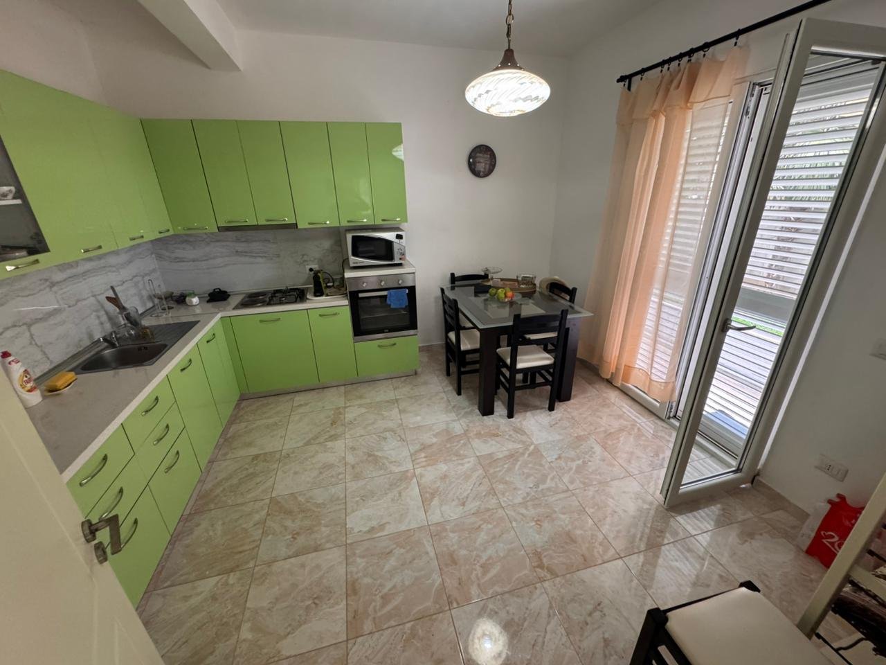 Modern Ulcinj kitchen for sale: light green cabinets, new appliances, terrace access&mdash;exclusive Ekosphere/ immorenta.me property.