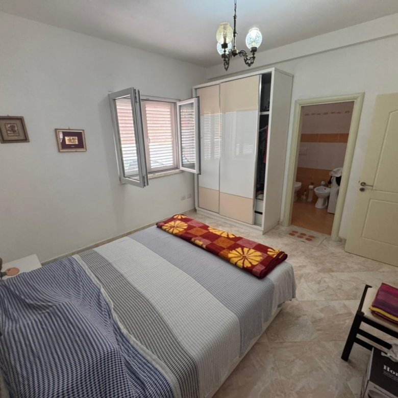 Modern Ulcinj bedroom with double bed, chic wardrobe, and sunny windows&mdash;ideal eco-real estate. Listed by immorenta.me/Ekosphere.