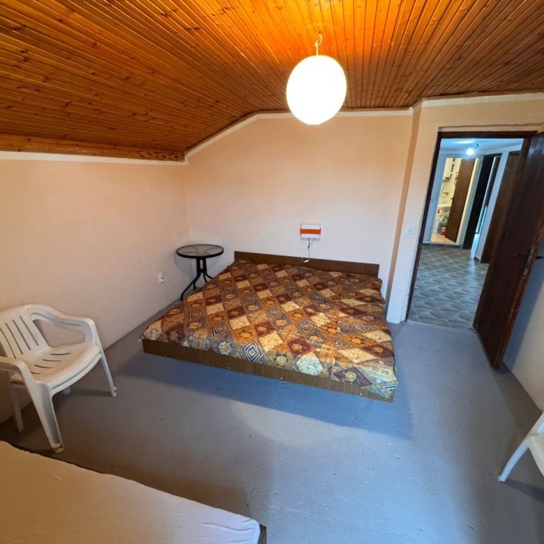 Cozy Ulcinj room with wood paneling, bed, chairs, and table&mdash;investment potential in Montenegro by immorenta.me/Ekosphere doo.