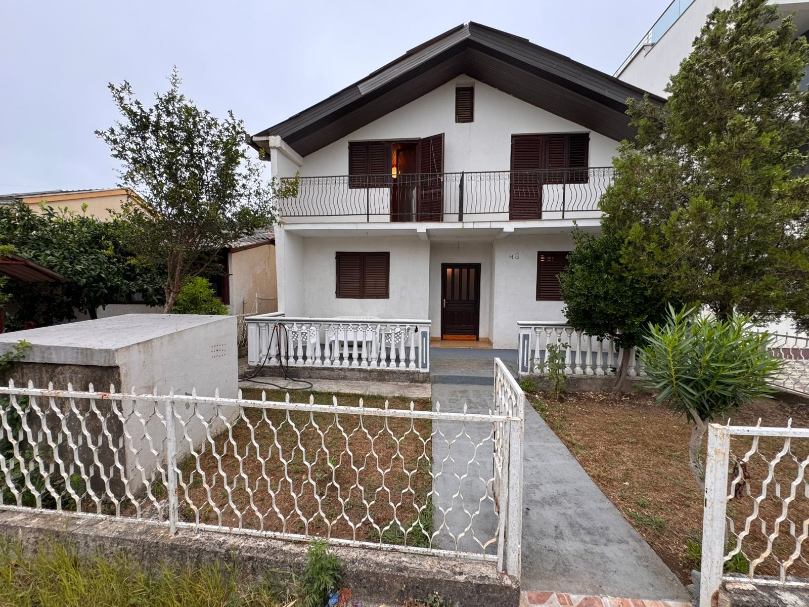 Elegant two-story white house in Ulcinj, Montenegro with balcony, fenced yard&mdash;prime investment on immorenta.me by ekosphere doo.