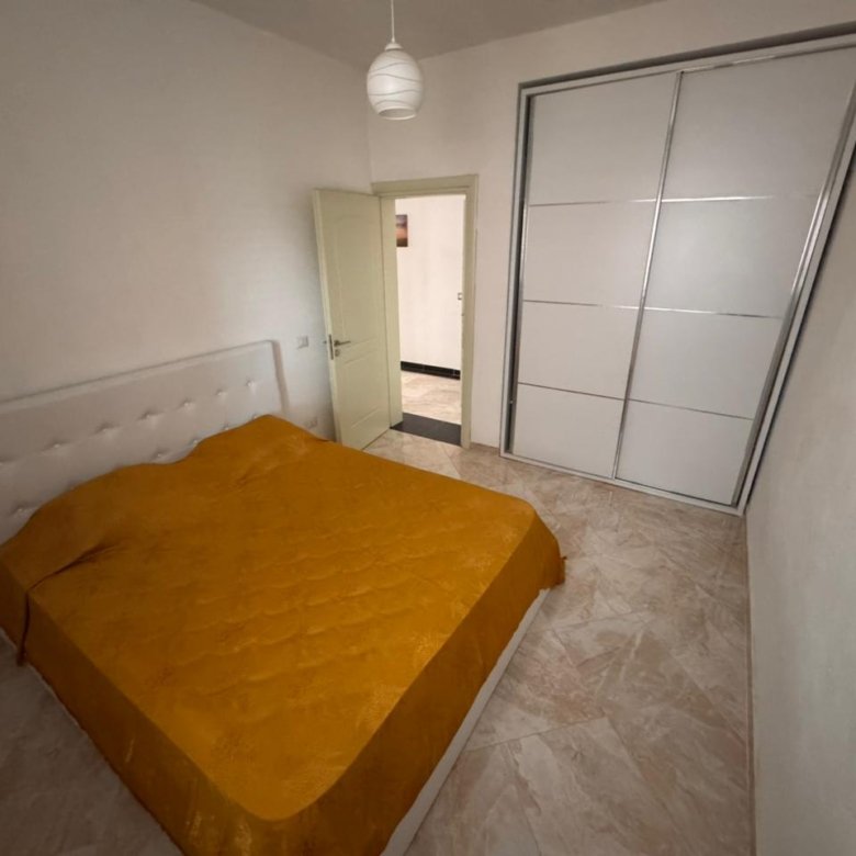 Stylish Ulcinj bedroom with double bed, modern wardrobe, art accents&mdash;exclusive real estate by Ekosphere on immorenta.me.