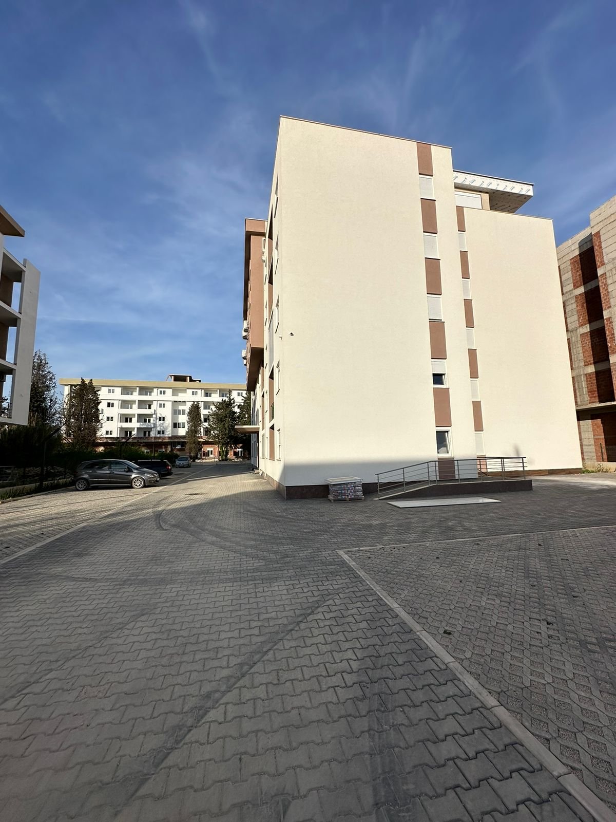Modern beige multi-storey apartment in Ulcinj, Montenegro with private parking; premium investment at immorenta.me by Ekosphere doo.