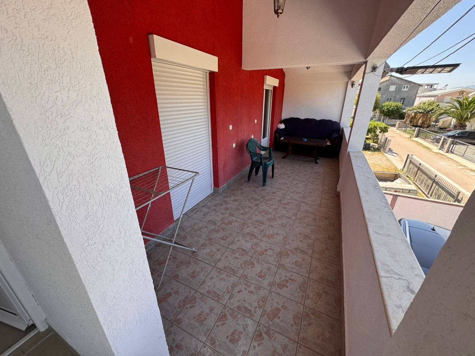 Spacious tiled balcony in Ulcinj with stylish seating, city views&acirc;prime investment via immorenta.me by Ekosphere doo.